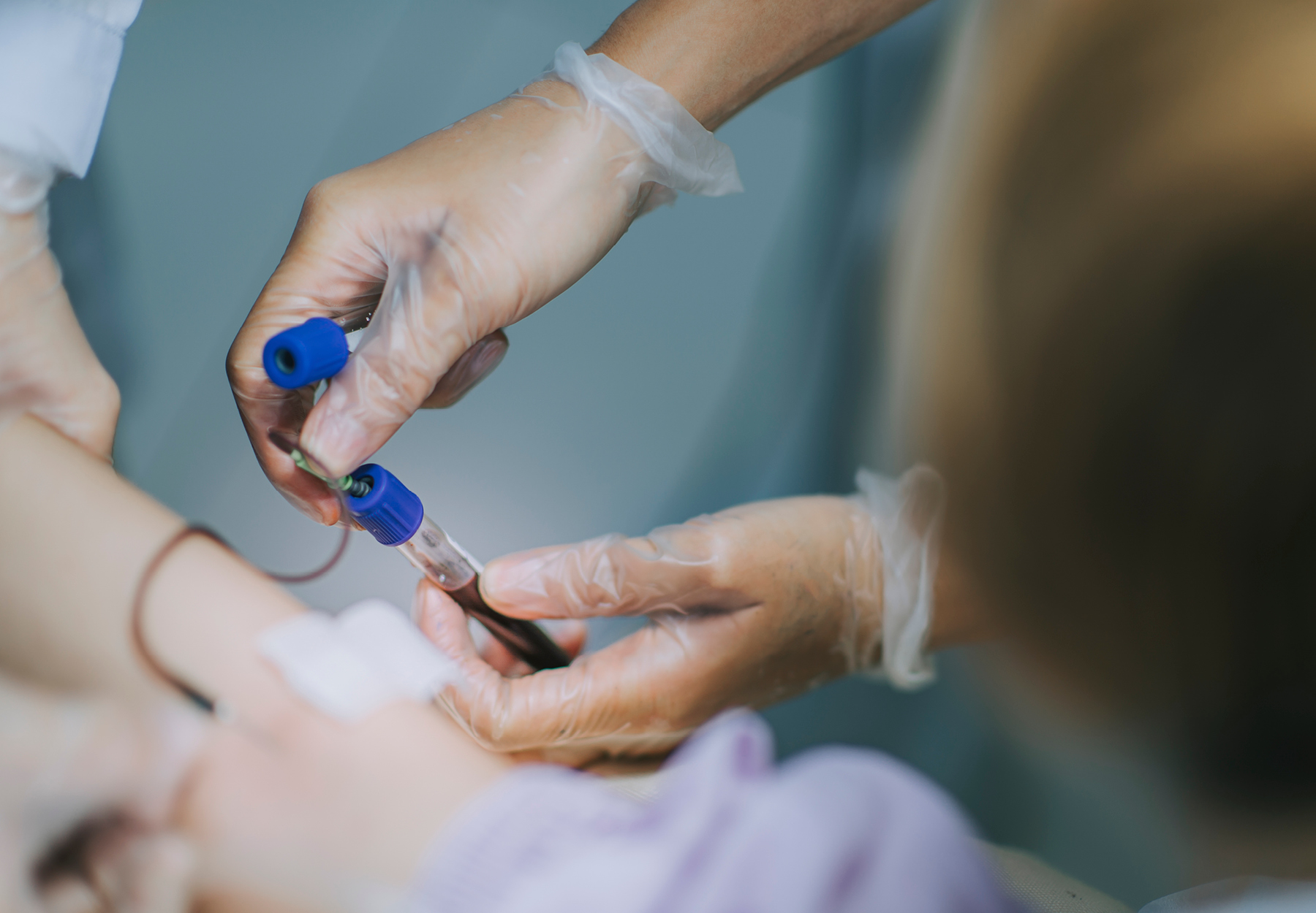 A nurse drawing blood for a blood test.