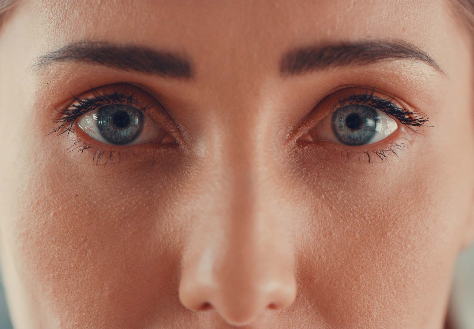 Closeup of woman's eyes and nose.