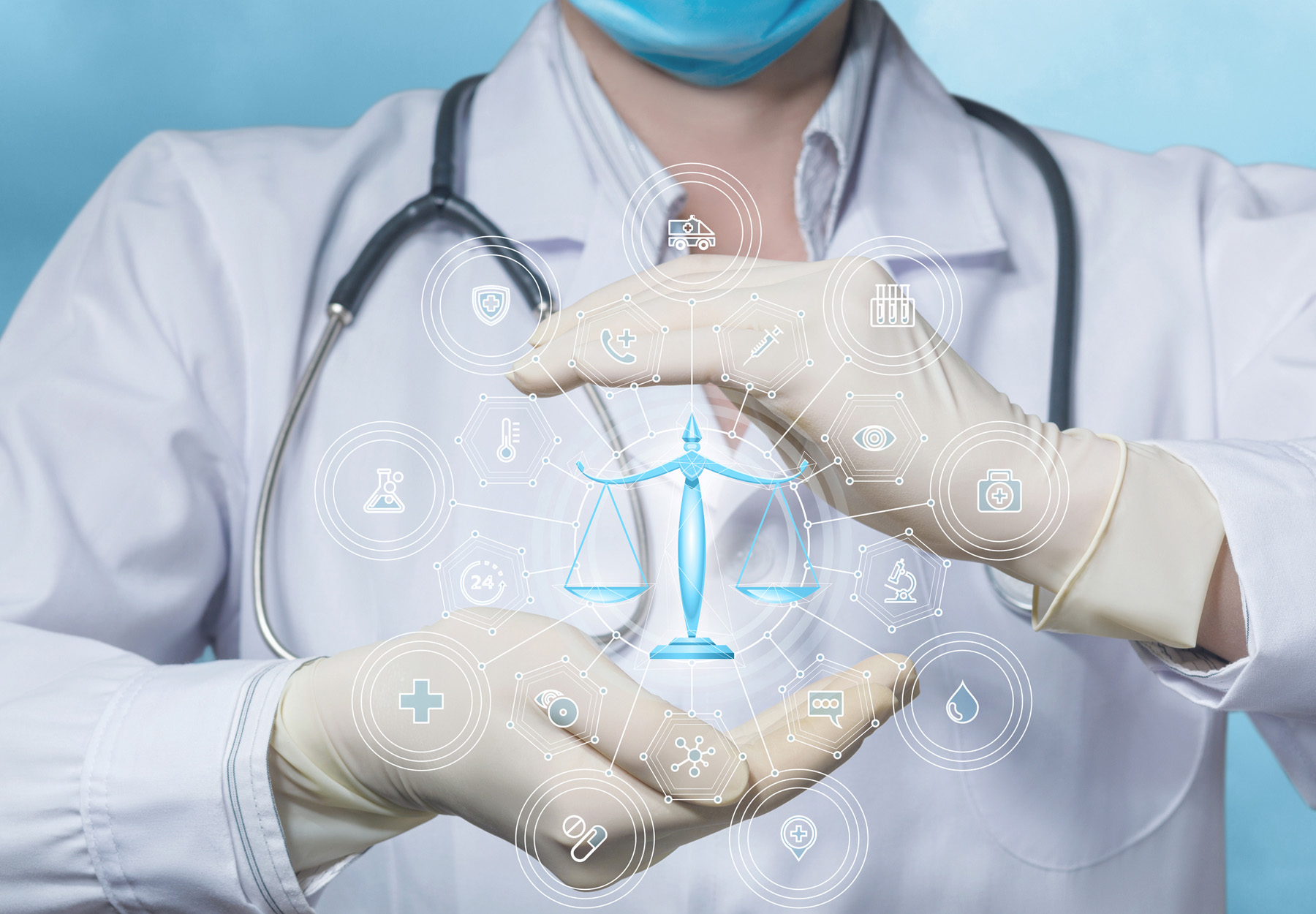 A closeup of a doctor holding a scales icon to represent legal cases involving the medical industry
