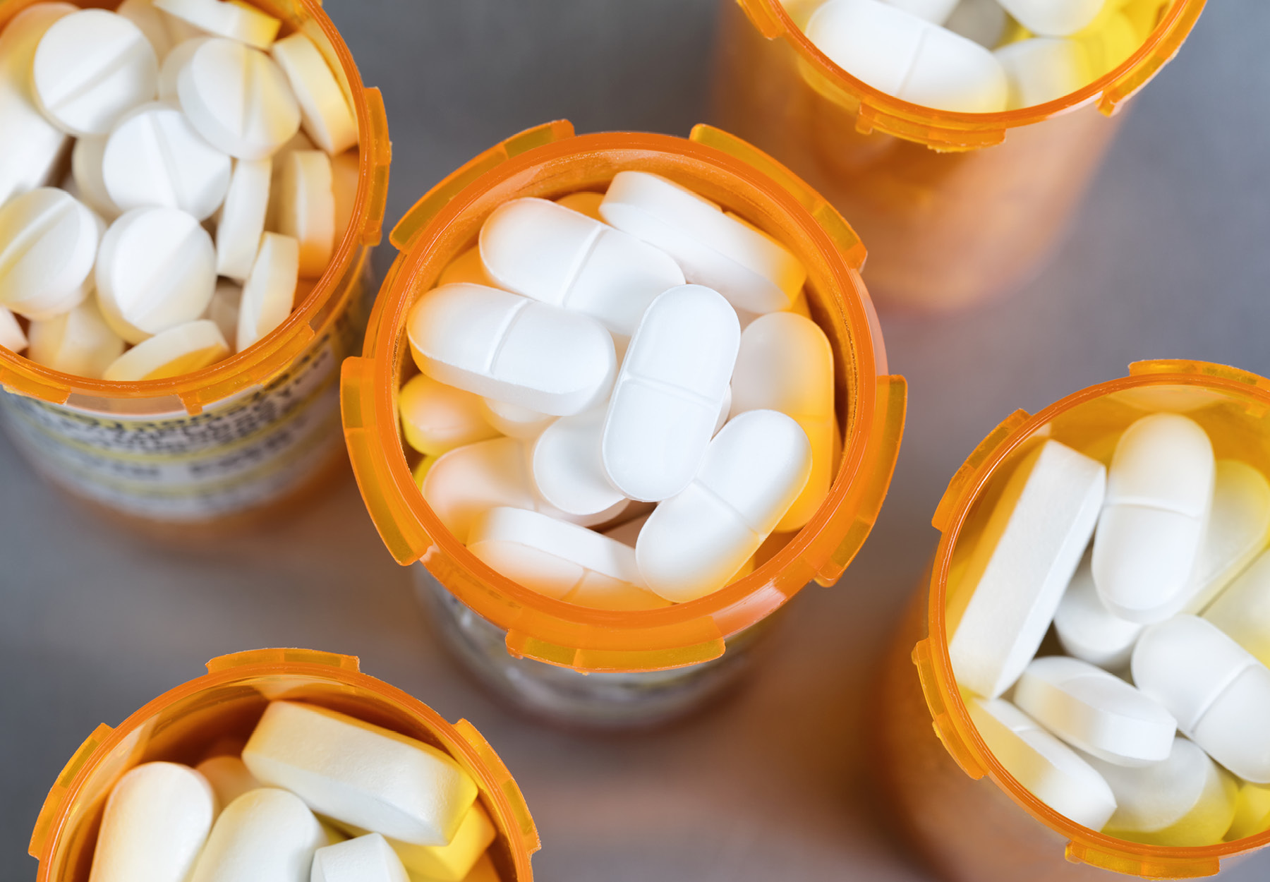 An over head view of orange bottles of pills