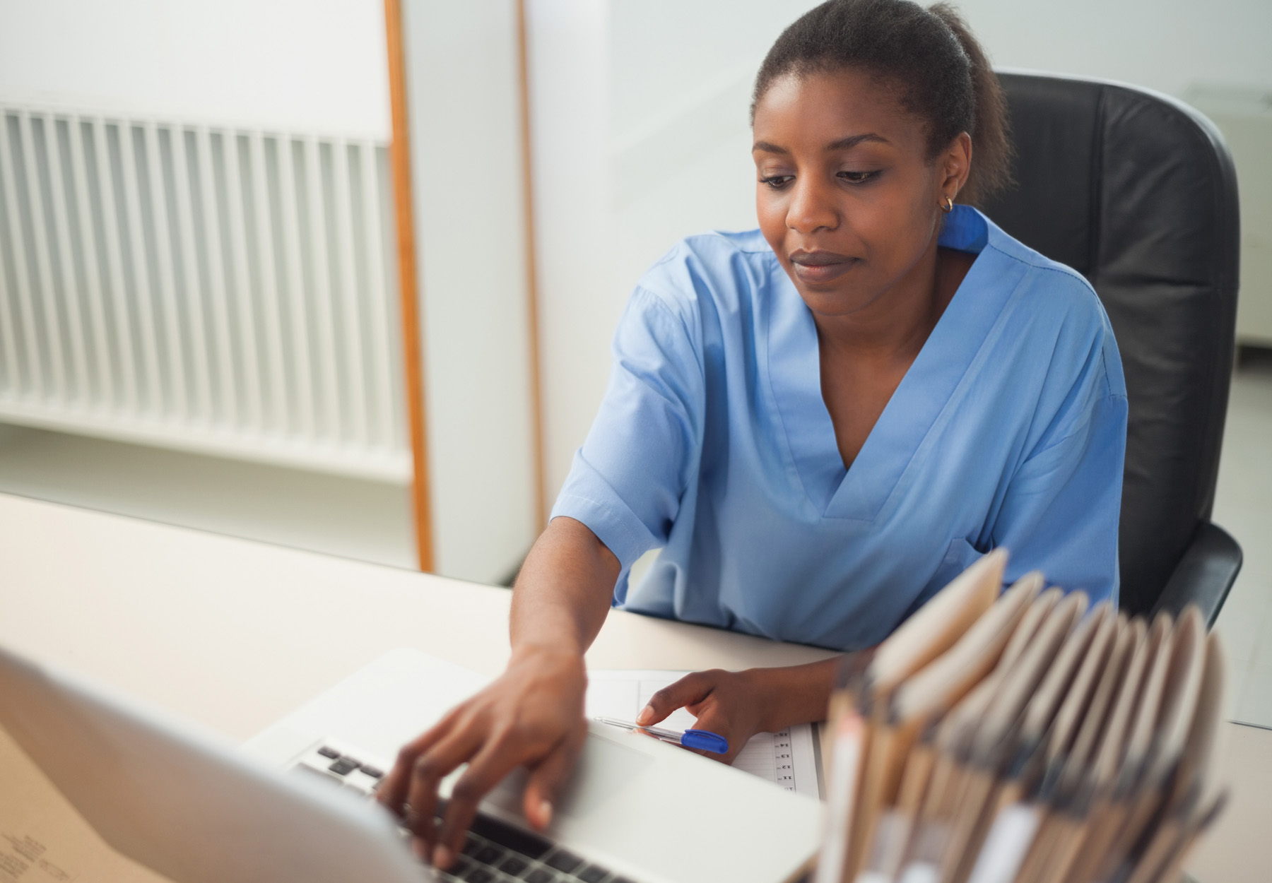 A nurse accesses a patient's electronic health record.