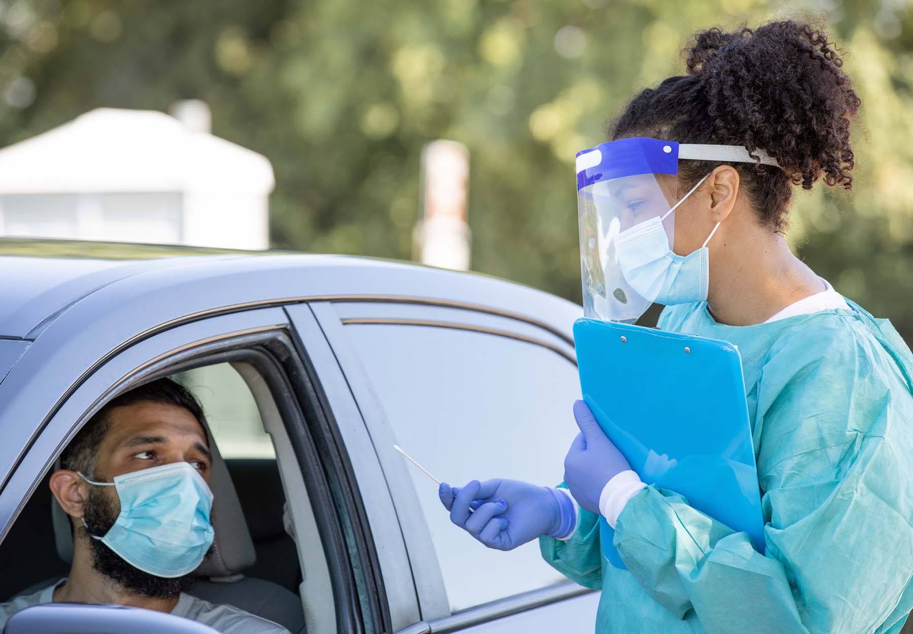 A stock image showing a drive through testing site for Covid-19 patients