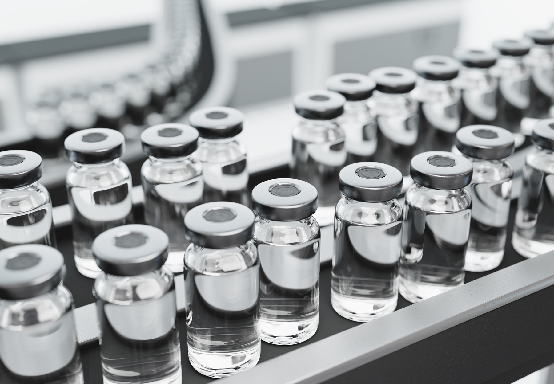 Vaccine vials on a production line in a pharmaceutical factory..