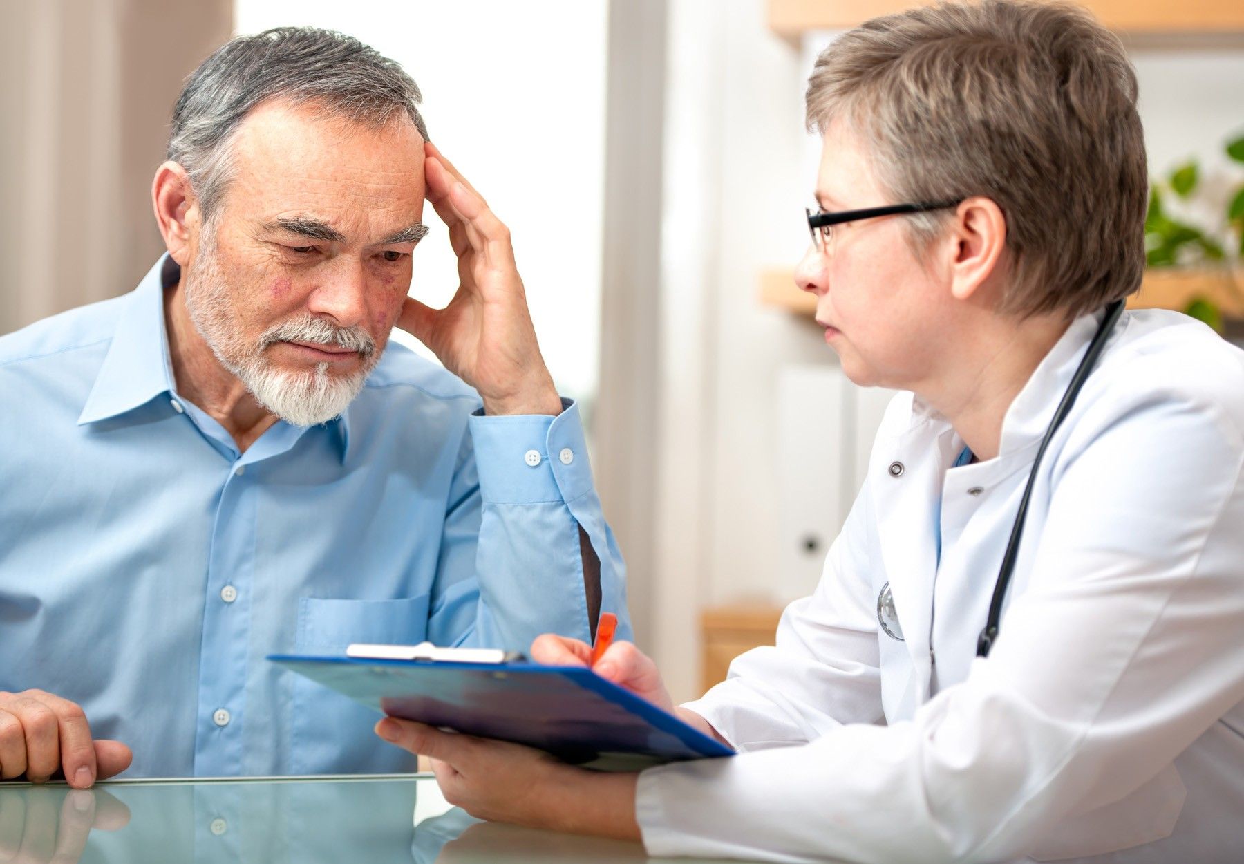 Doctor meeting with stressed patient