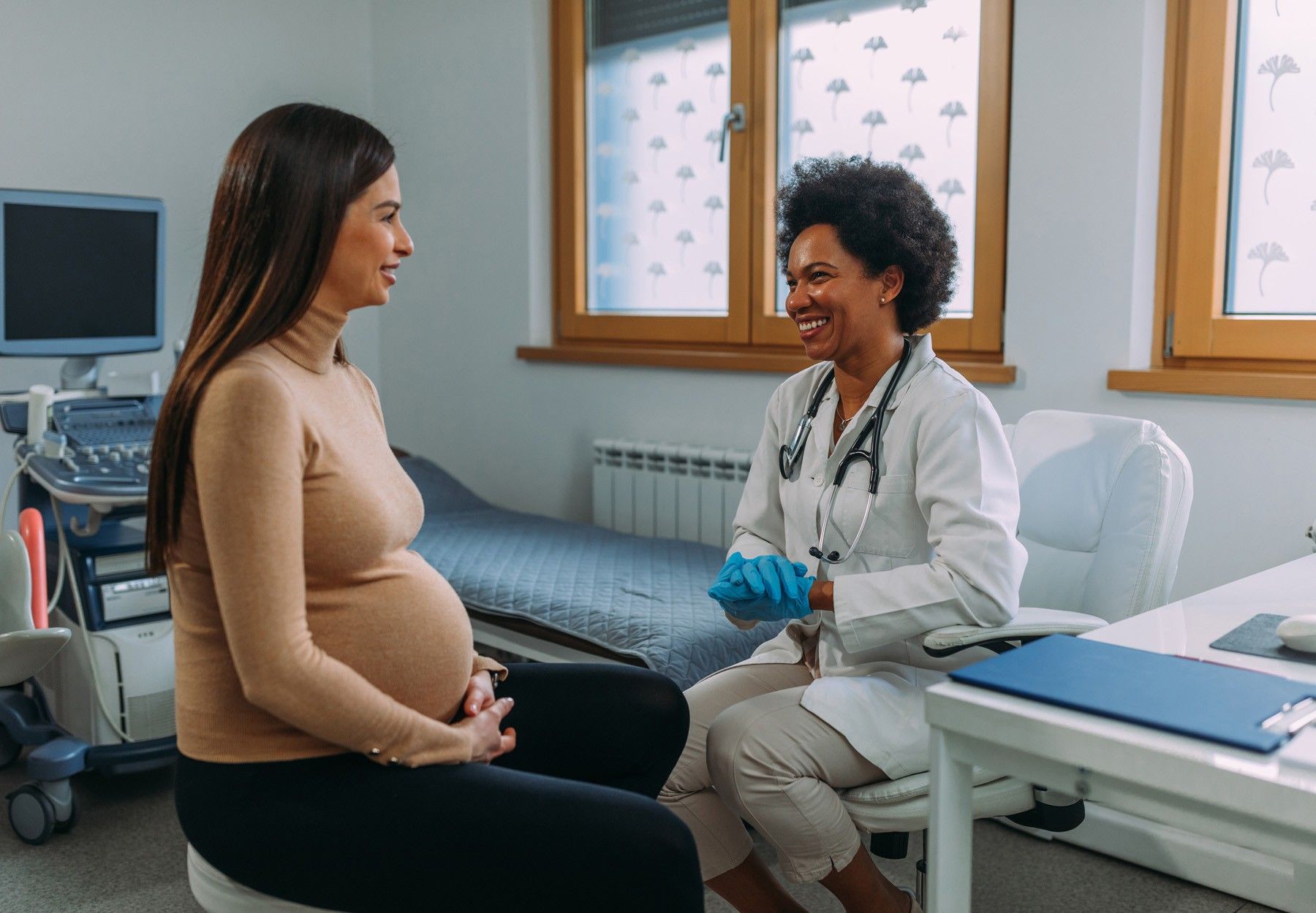 A pregnant woman during a routine check up with her doctor at hospital