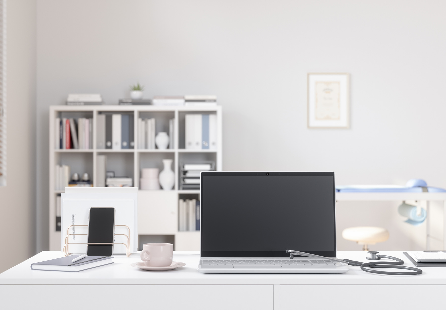 Image of a phone and laptop in doctor's office to show the concept of telemedicine.