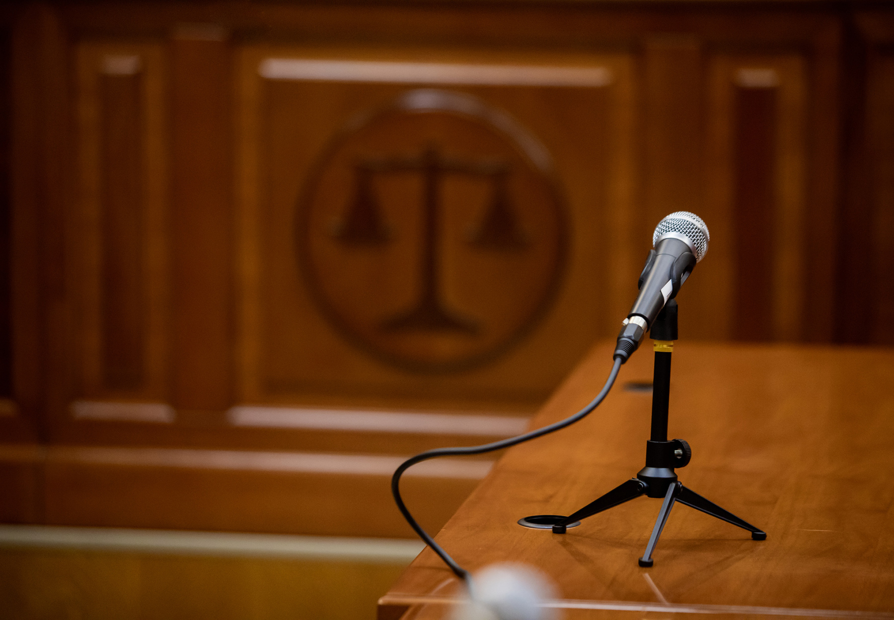 Stock image of a microphone in the courtroom