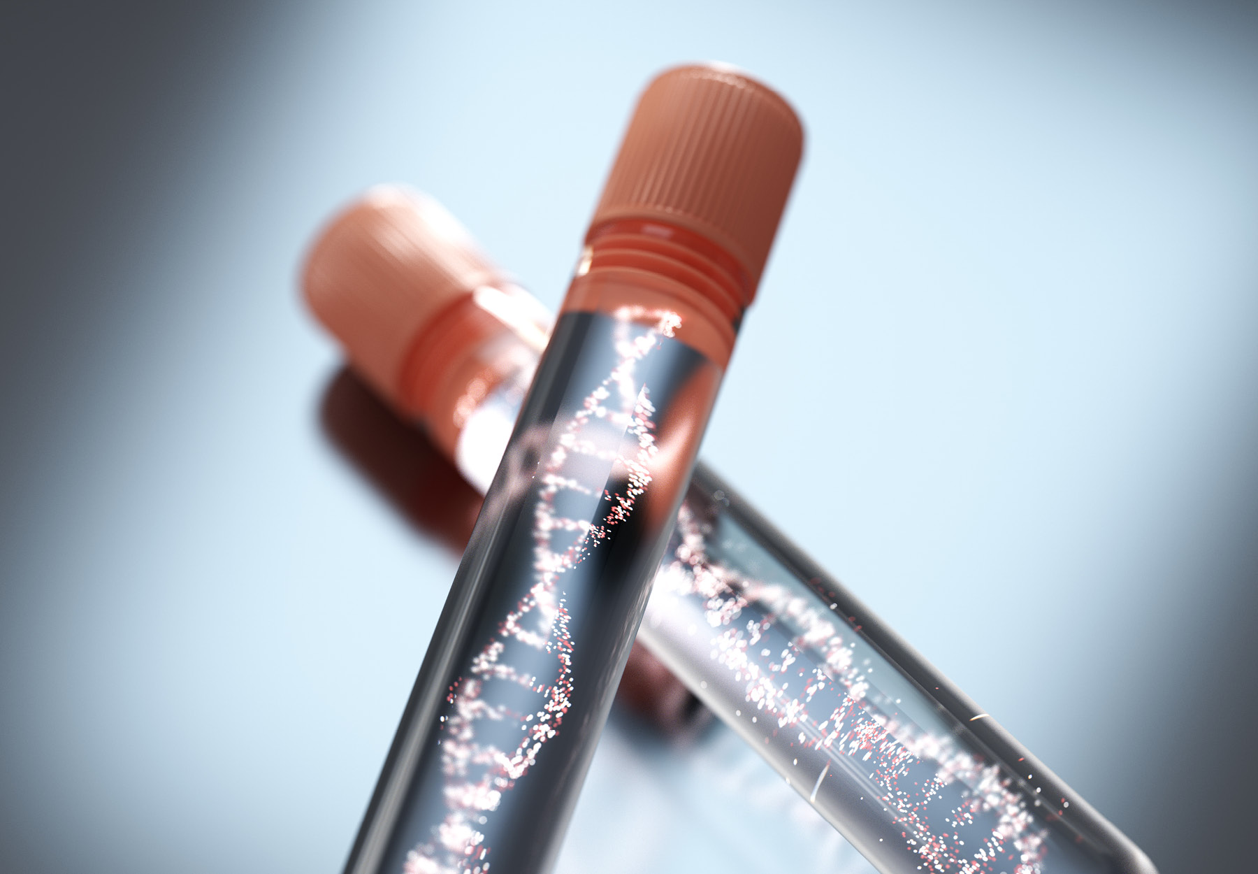 Stock image of crossed test tubes with DNA strand image inside to show concept of genetic testing