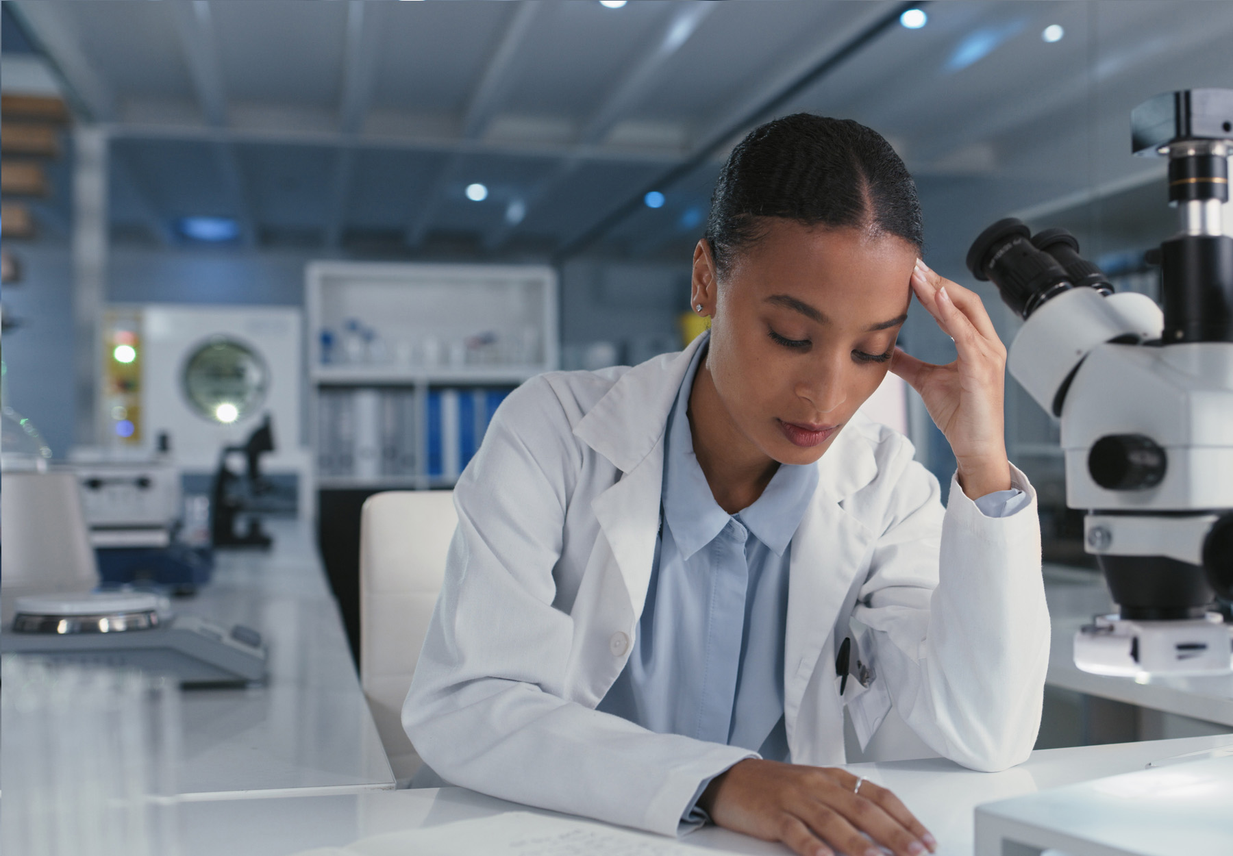Shot of a young scientist looking stressed while conducting medical research in a laboratory stock photo