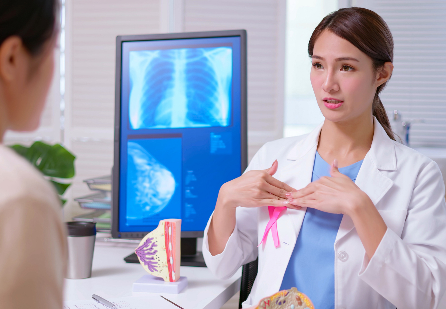 Female patient meeting with her female doctor about a breast examination. iStock image.