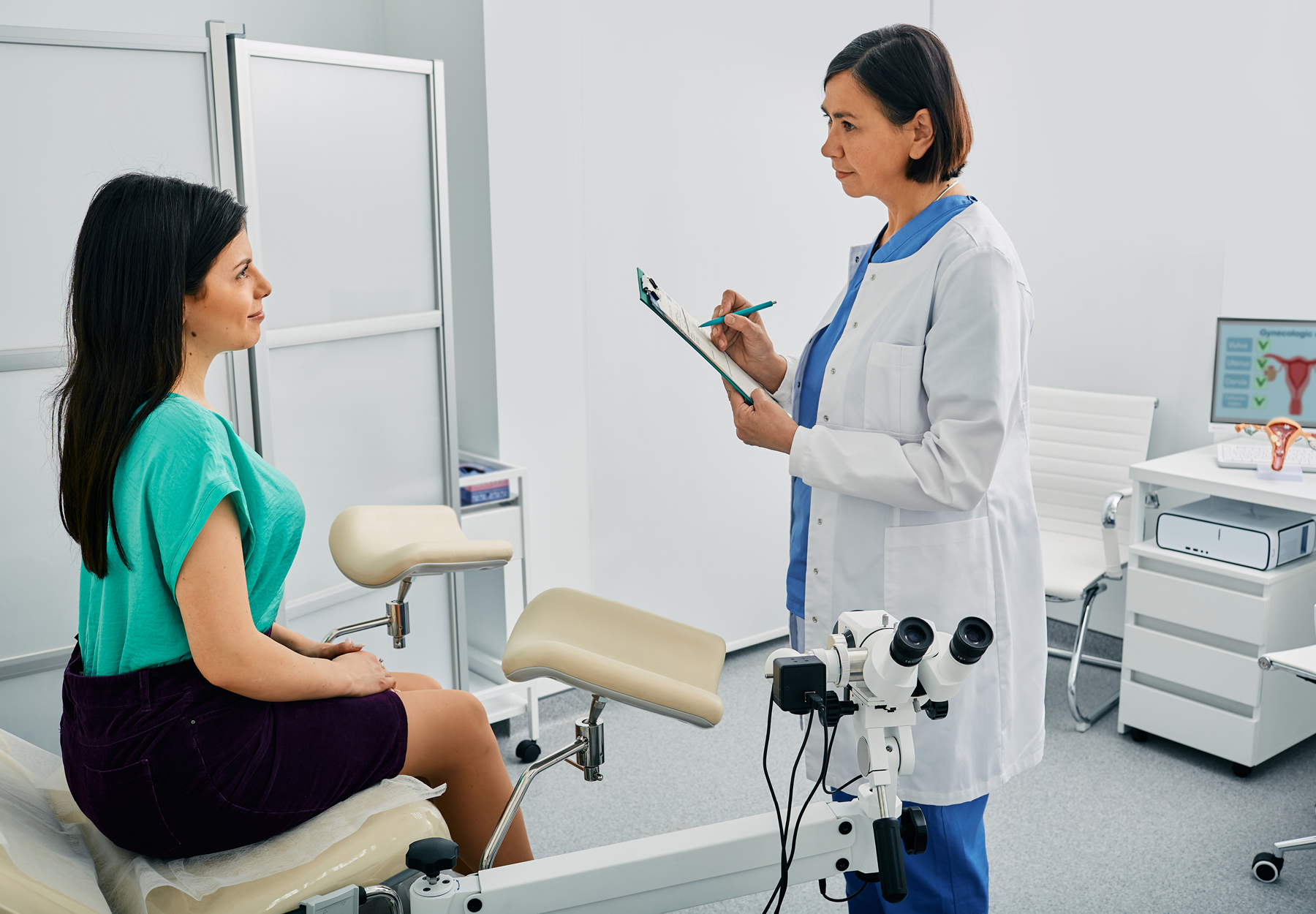 Young woman during appointment with mature gynecologist at gynecology clinic. Women's health. Reproductive health. iStock image.