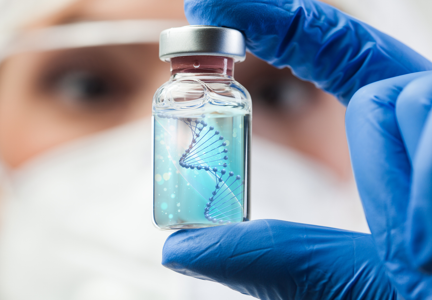 Lab scientist clinical technician biotechnologist holding glass ampoule vial with dna strand istock image