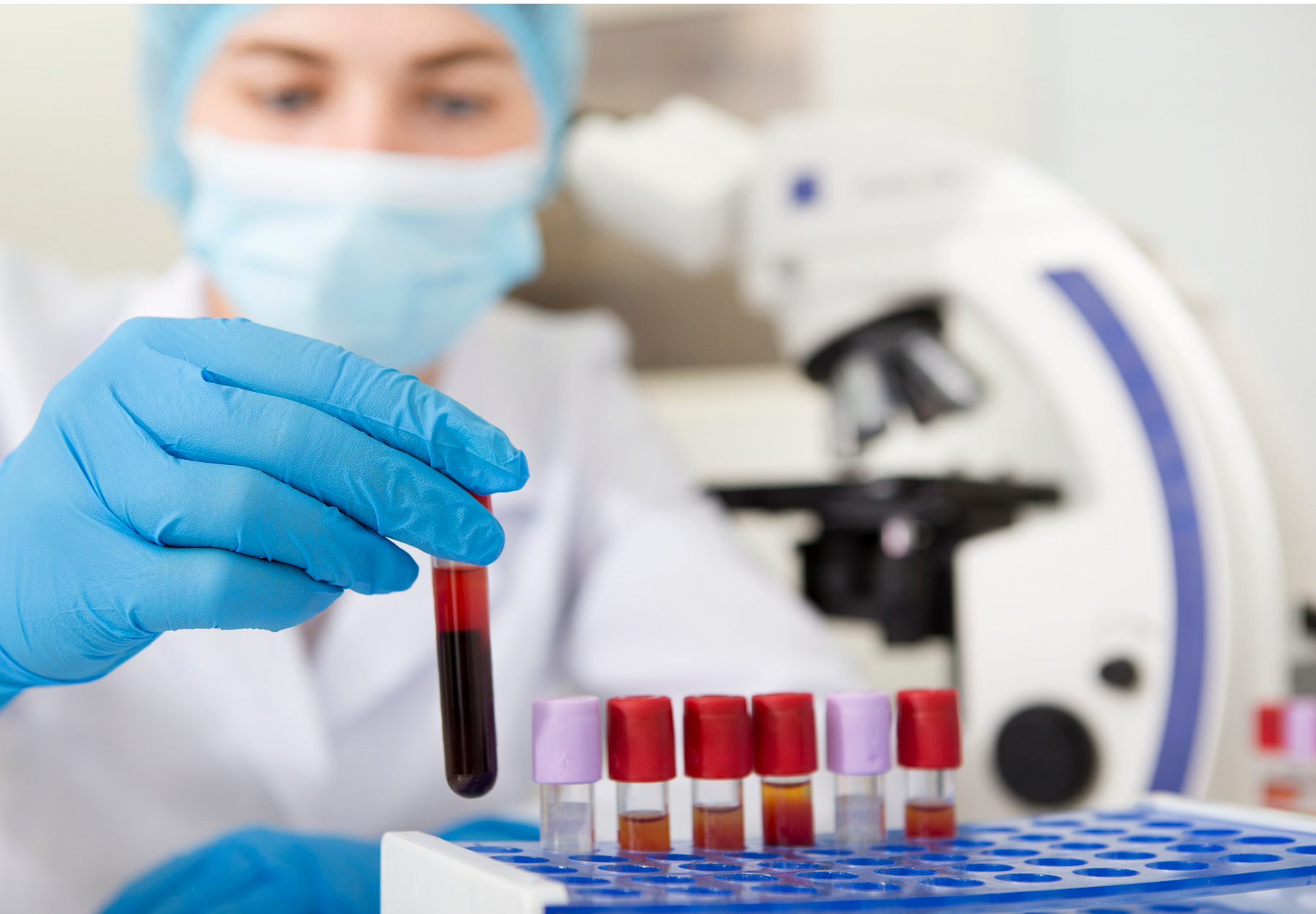 Laboratory technician working with blood samples. iStock image.