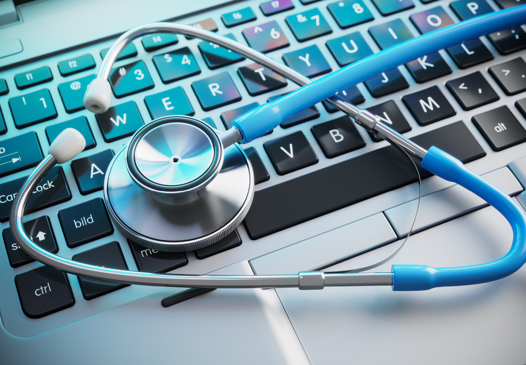 Stethoscope on laptop keyboard. 3d render. iStock image.