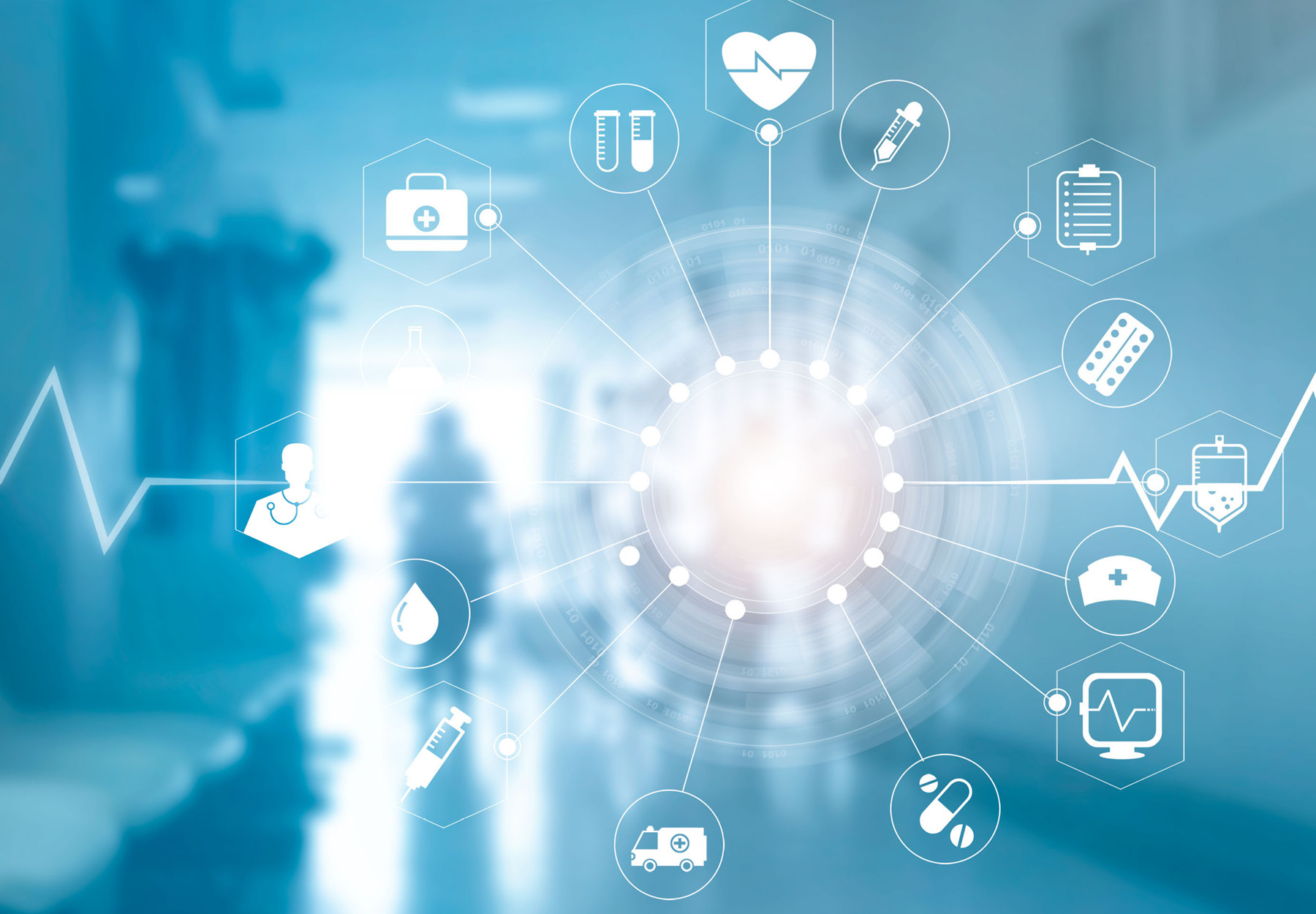 Blue-toned photo illustration of hospital hallway with various healthcare-related icons overlaid in white. Healthcare industry concept. iStock image.