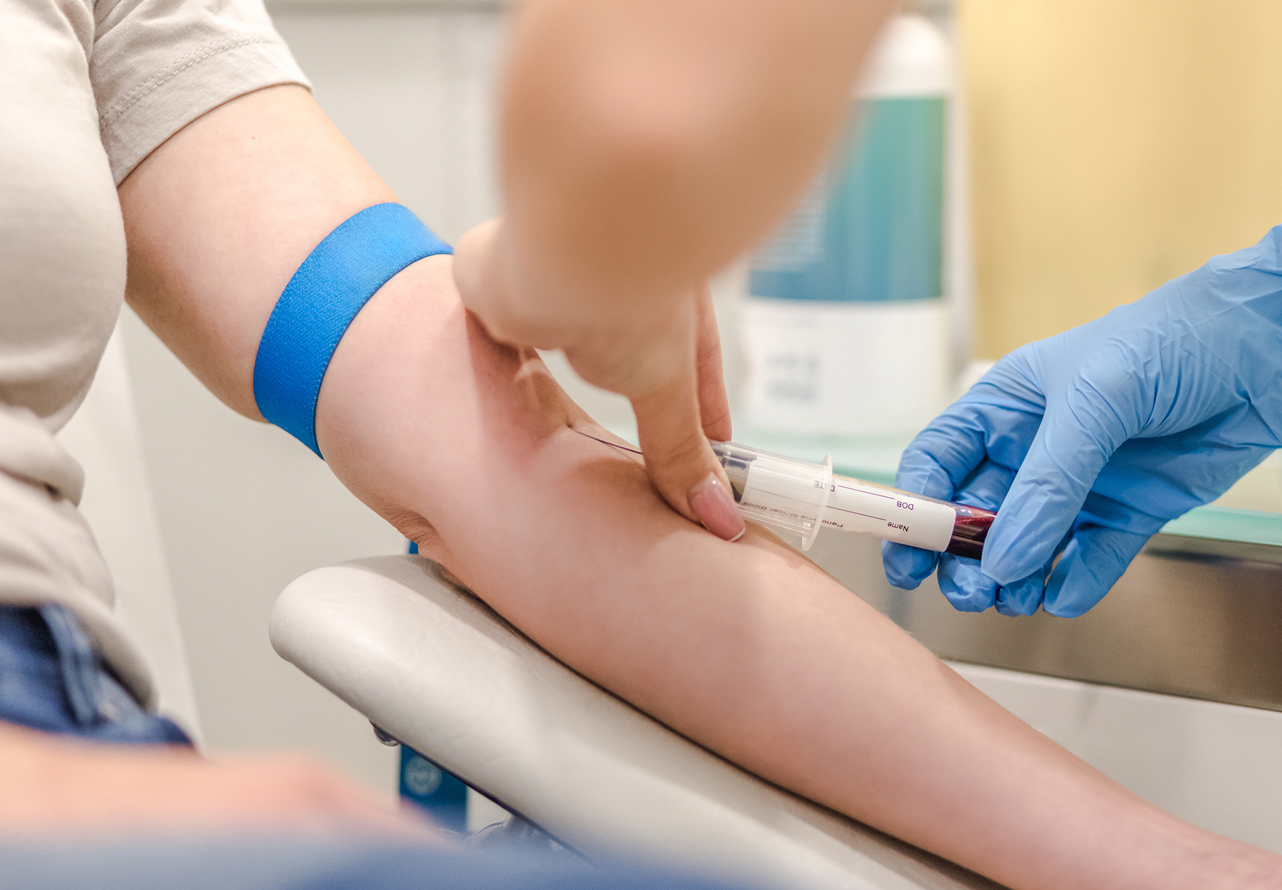 Close-up Of Doctor Taking Blood Sample From Patient's Arm in Hospital for Medical Testing. iStock image.