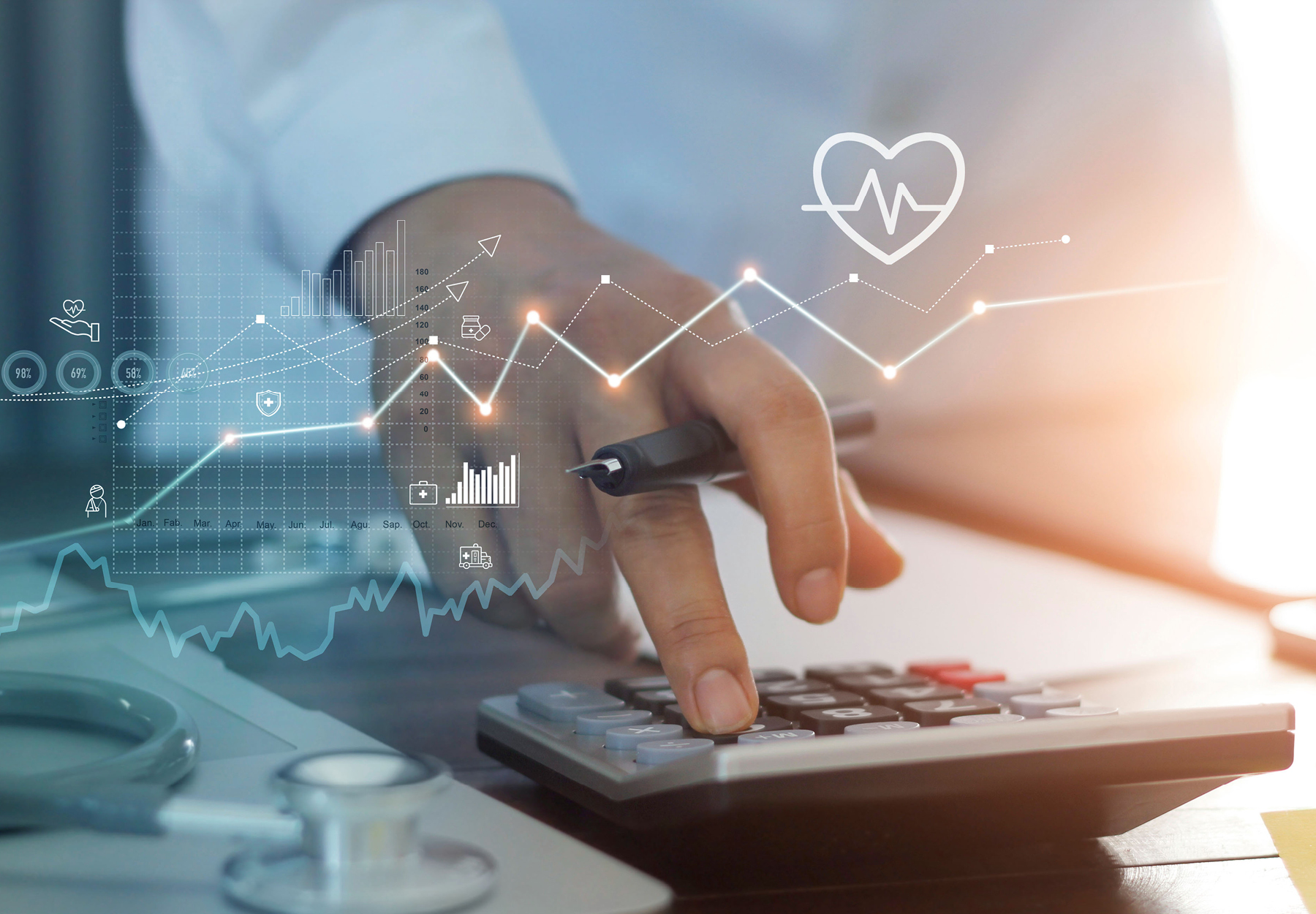 Closeup of healthcare professional using a calculator with graphics showing healthcare business graph data and growth. Stock photo illustration.