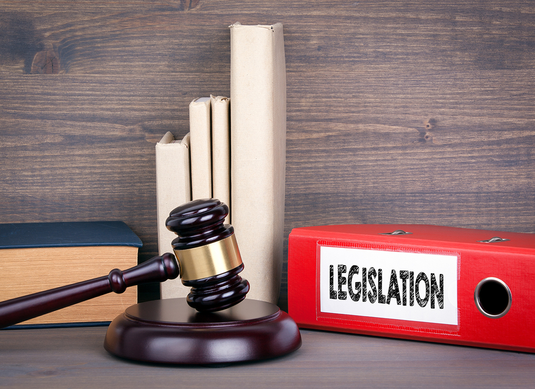 Wooden gavel and books in background. Law and justice concept. Stock image.