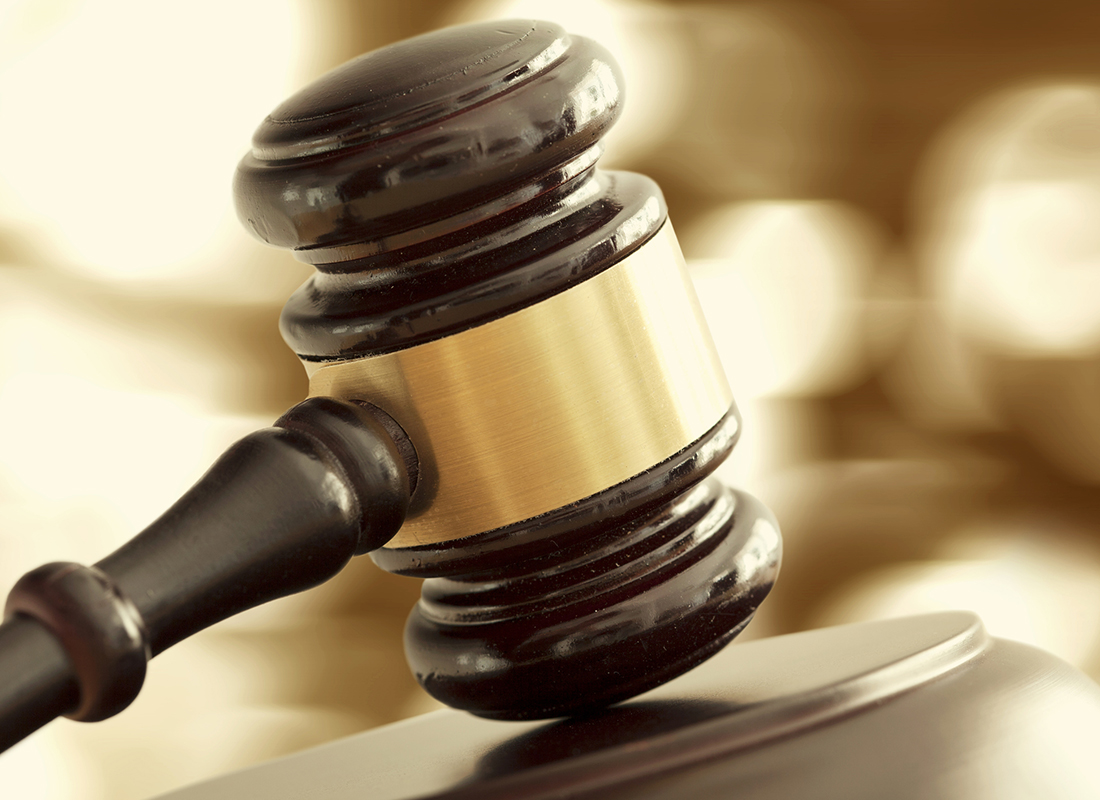 Closeup of wooden gavel on table.