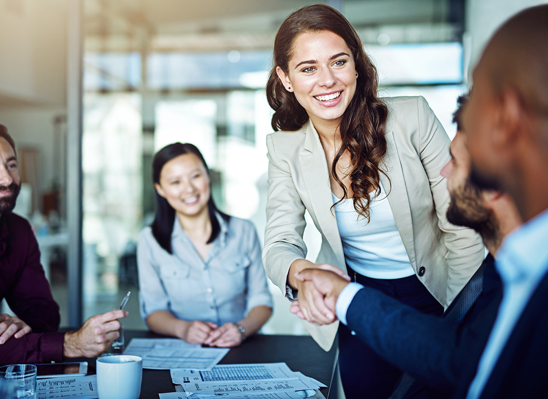 Cropped shot of two businesspeople shaking hands during a meeting in the boardroom. Business deal concept.