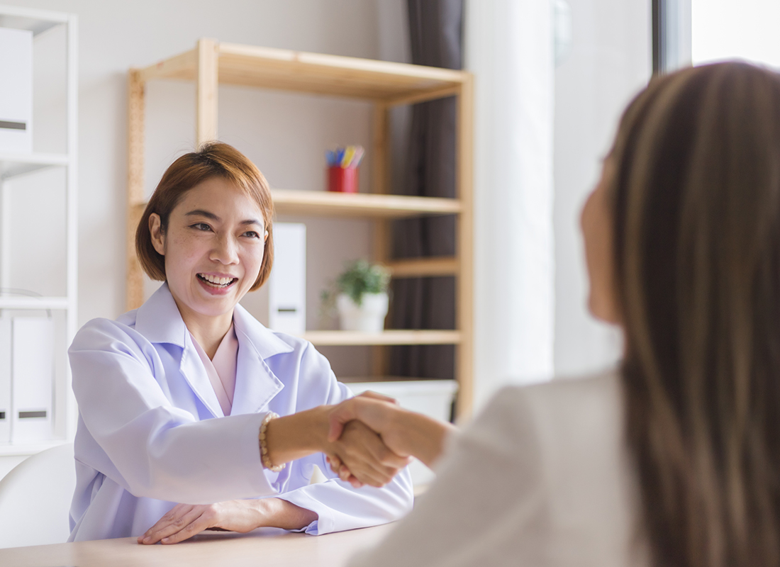 lab manager shaking hands with job candidate