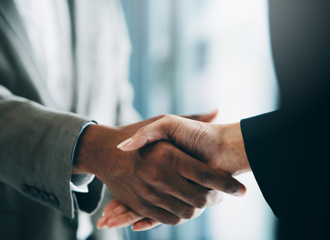 Closeup shot of two unrecognisable businesspeople shaking hands in an office