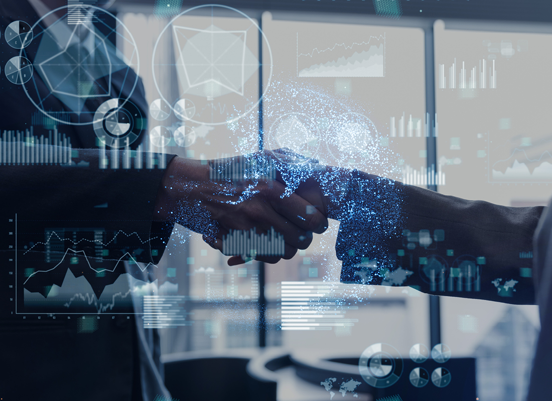 A closeup of two businesspeople shaking hands in an office with a graphical overlay of various types of charts and graphs, illustrating the concept of business deals.
