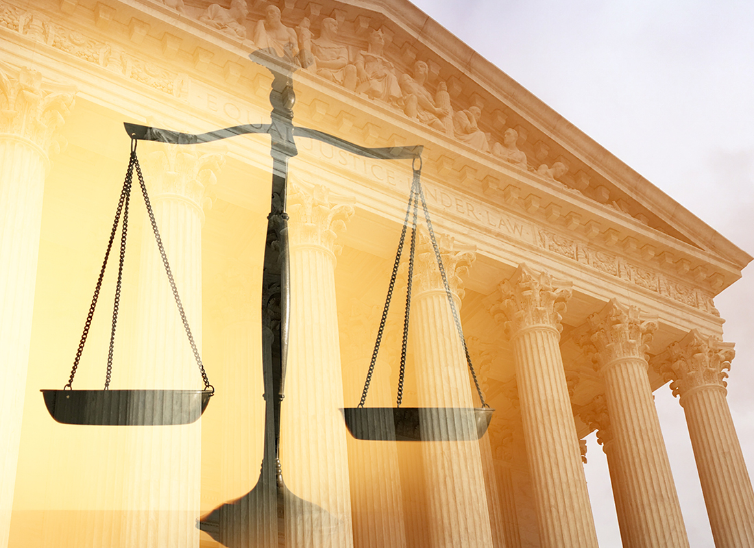 A justice scale and the United States Supreme Court building, representing a Supreme Court decision.