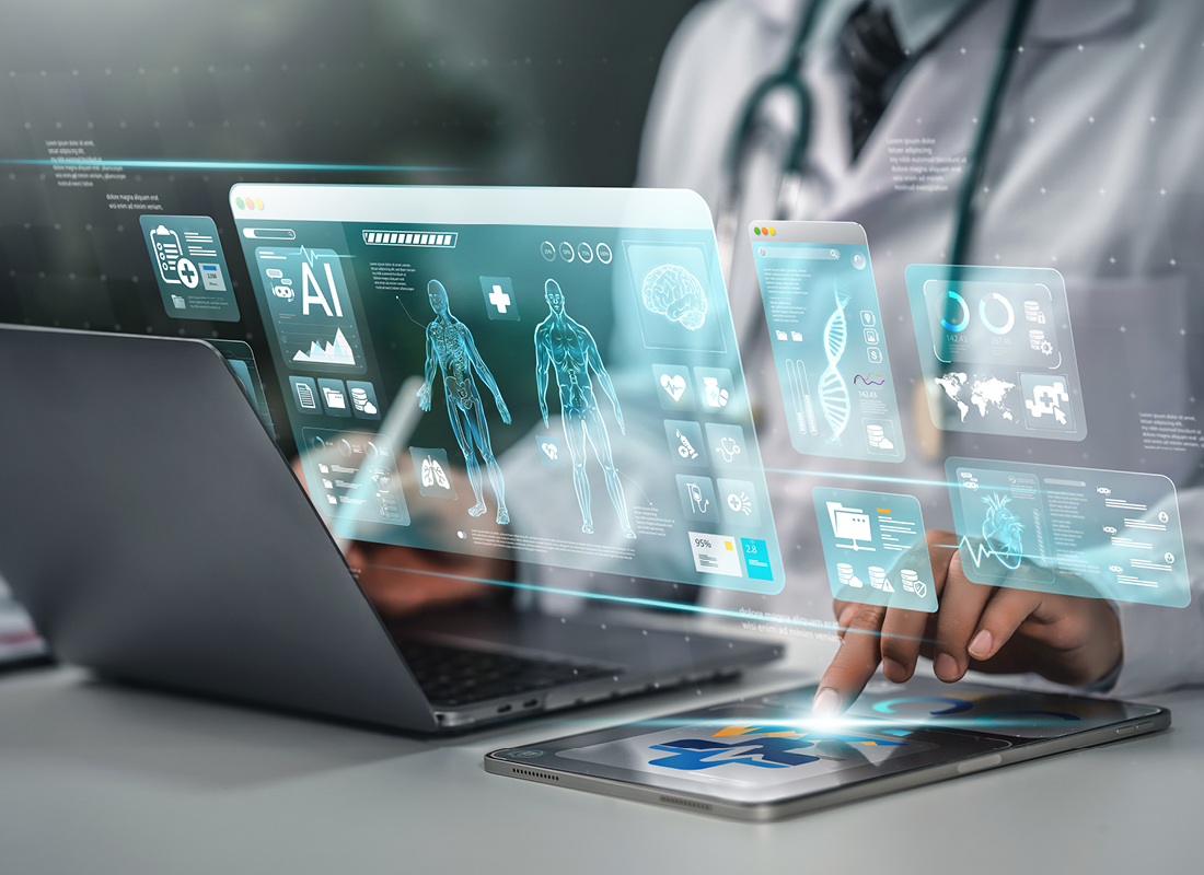 Physician working on a laptop with digital screens popping out
